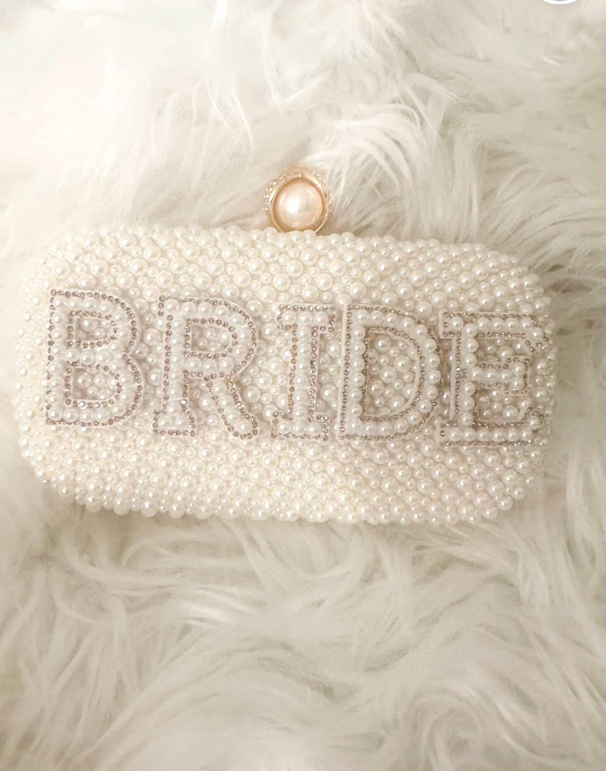 BRIDE Embellished pearl clutch bag