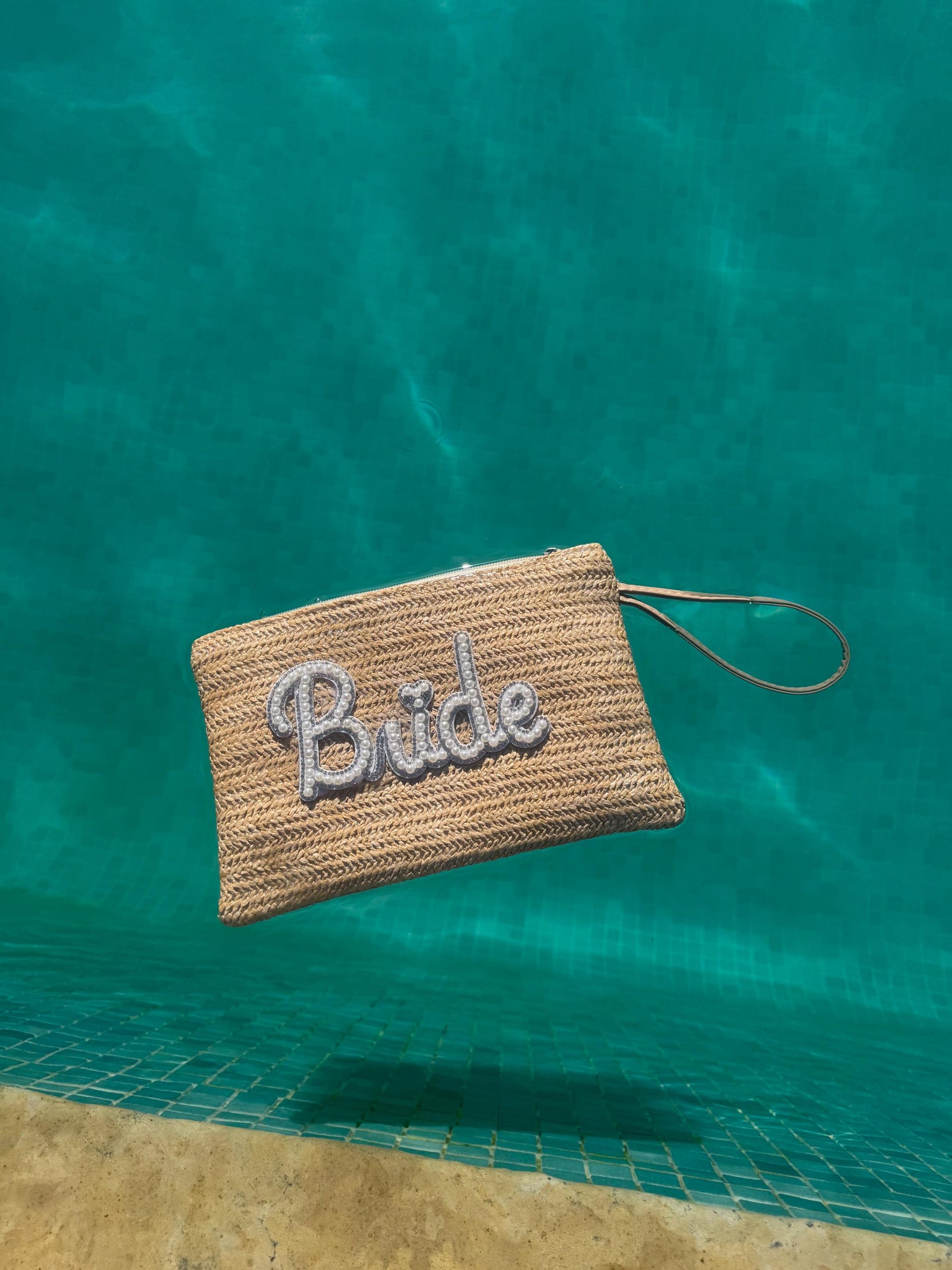 BRIDE Pearl embellished woven straw clutch