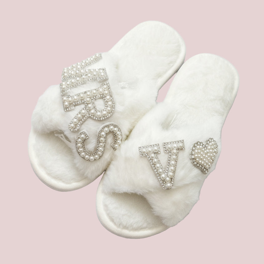 White slippers with MRS  embellishments